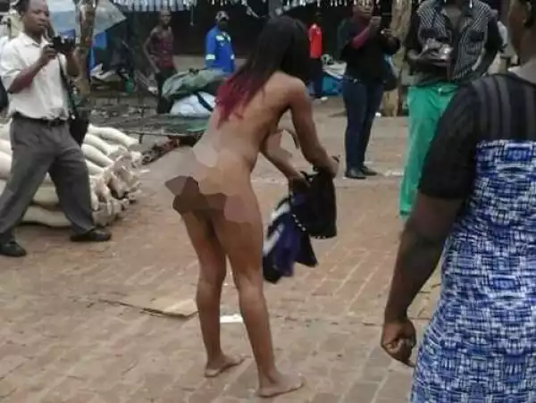 Shocking! Woman Strips N*ked After Being Booed by Street Vendors for Wearing Skimpy Dress at a Market (Photo)